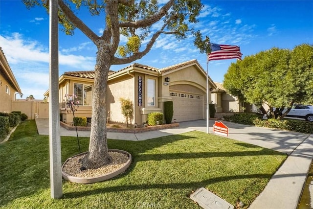 view of front facade with a garage and a front lawn