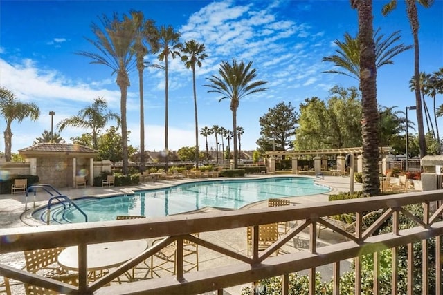 view of swimming pool with a patio