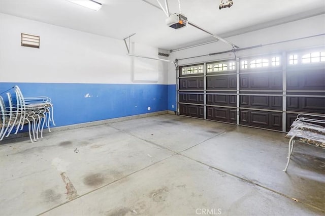 garage featuring a garage door opener