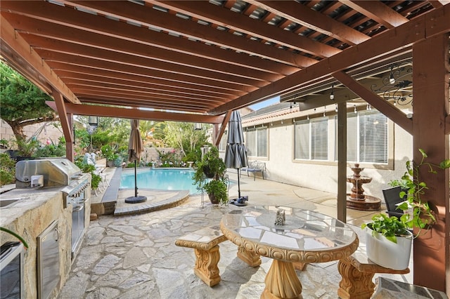 view of patio featuring a grill and exterior kitchen