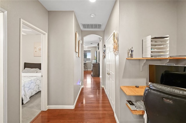 corridor featuring hardwood / wood-style flooring