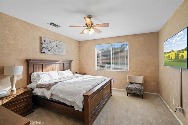 bedroom featuring ceiling fan and light colored carpet