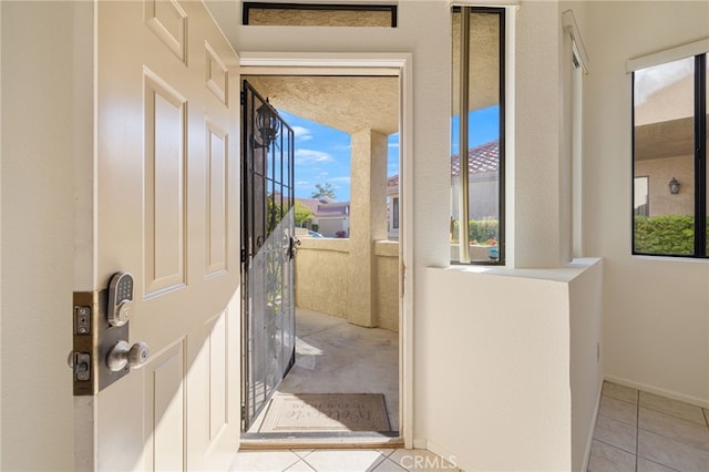 entryway featuring light tile patterned flooring