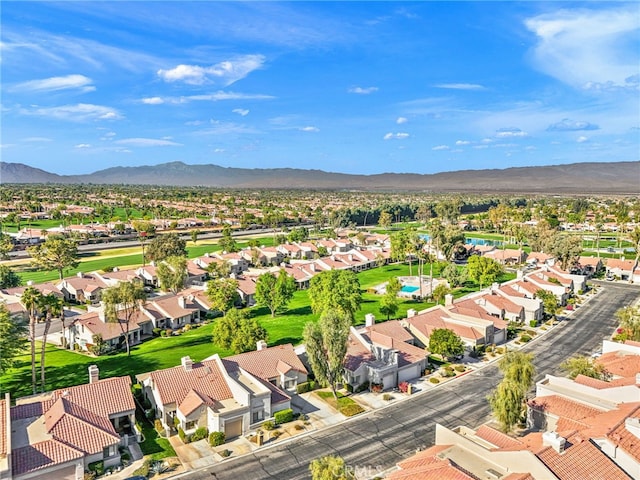 birds eye view of property with a mountain view