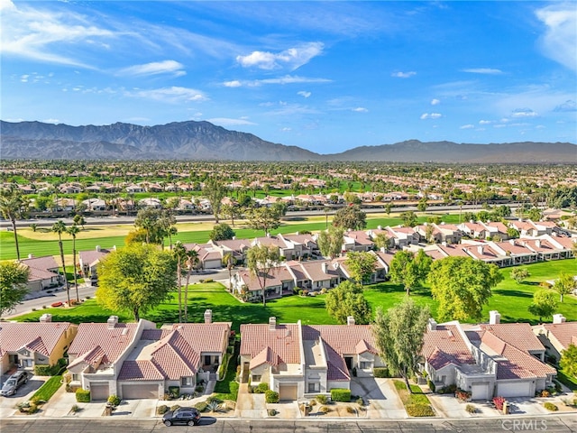 drone / aerial view featuring a mountain view