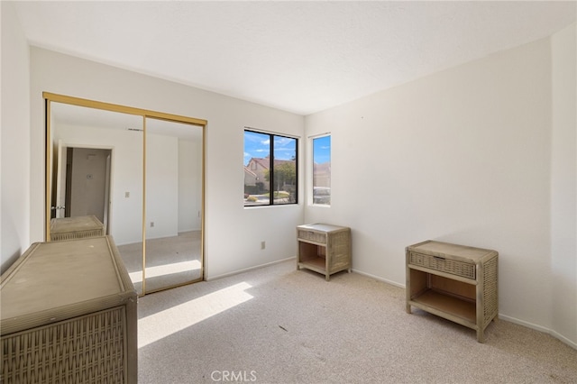 carpeted bedroom featuring a closet