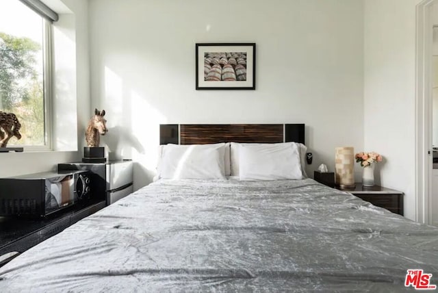 bedroom featuring multiple windows