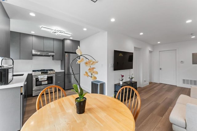 dining space featuring hardwood / wood-style flooring