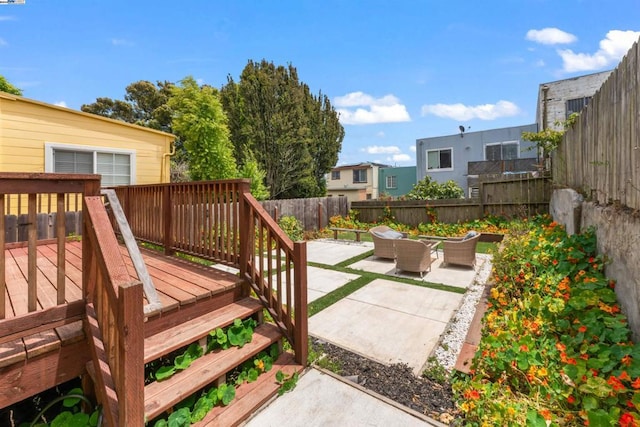 wooden deck with a patio area and an outdoor hangout area