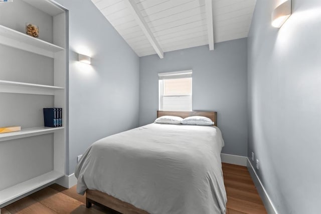 bedroom with lofted ceiling with beams, dark hardwood / wood-style flooring, and wooden ceiling