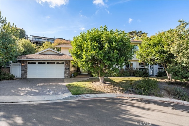 obstructed view of property with a garage