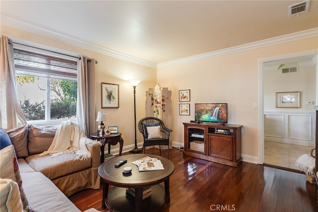 living room featuring crown molding and dark wood-type flooring