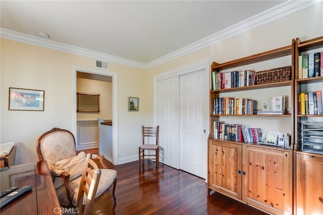 living area featuring ornamental molding and dark hardwood / wood-style floors