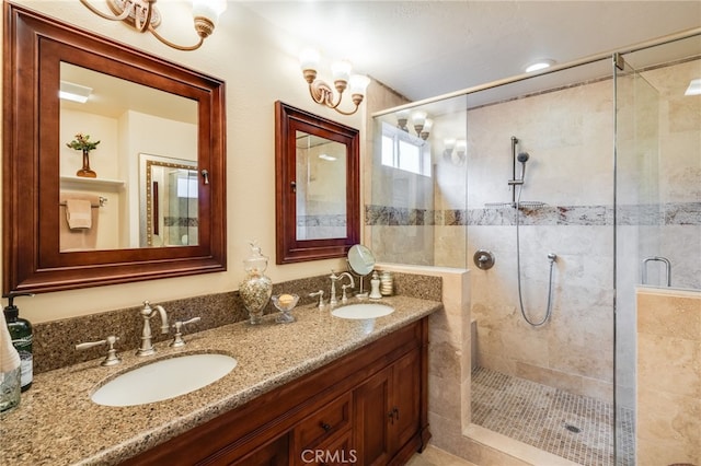 bathroom featuring vanity and a shower with shower door