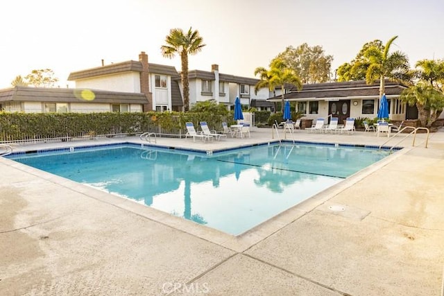 view of swimming pool featuring a patio area