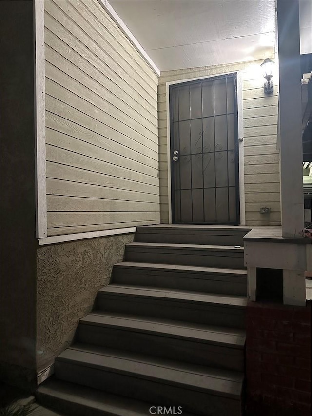4419 Radium Dr, Los Angeles, CA 90032 - staircase featuring a sauna / steam room and wood walls