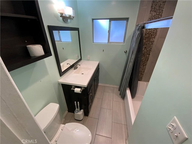 full bathroom featuring toilet, shower / bath combo, and vanity