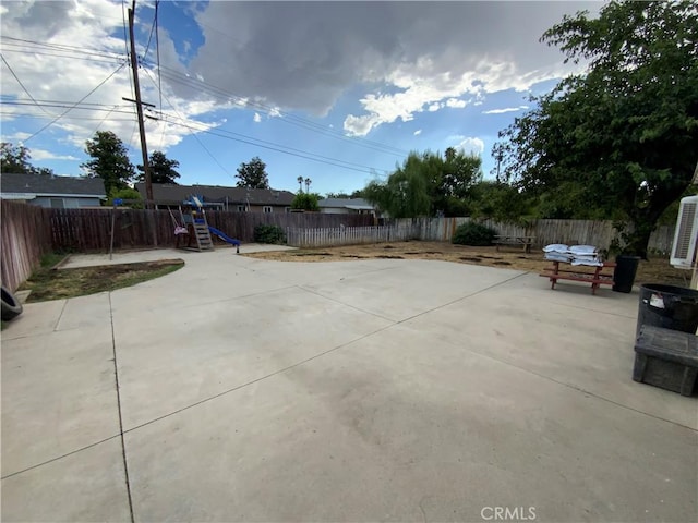 view of patio featuring a playground