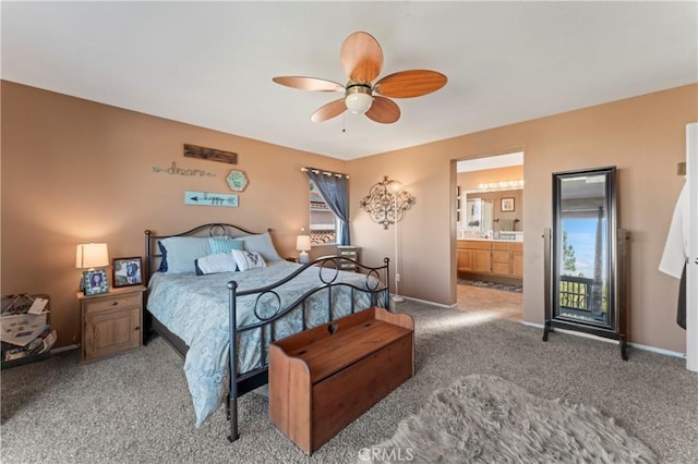 bedroom with ensuite bath, ceiling fan, and carpet floors