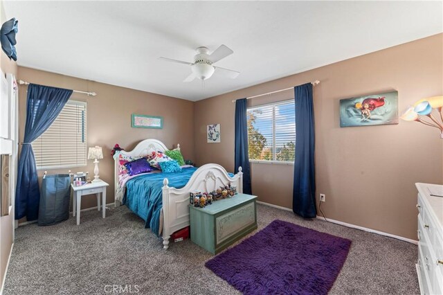 bedroom with carpet flooring, ceiling fan, and baseboards