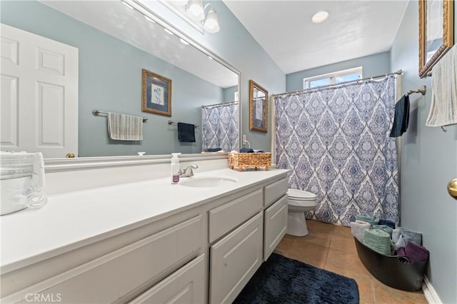 full bath with vanity, toilet, and tile patterned floors