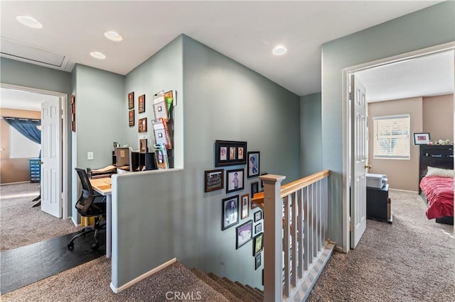 hallway with baseboards, carpet, an upstairs landing, and recessed lighting