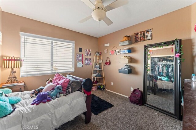 bedroom with ceiling fan, carpet flooring, and baseboards