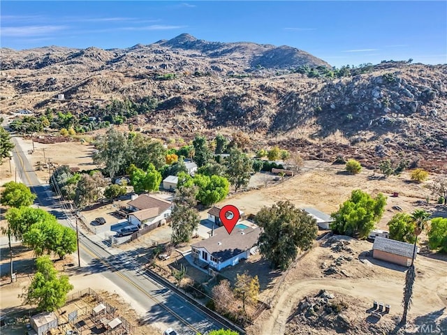 birds eye view of property with a mountain view