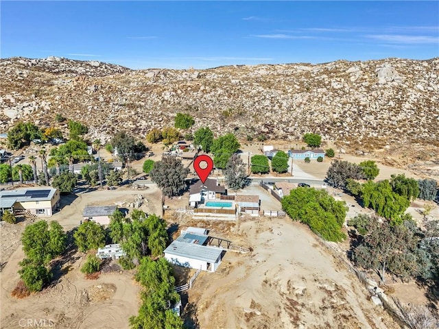 birds eye view of property featuring a mountain view