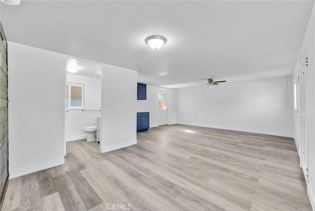 unfurnished living room with ceiling fan and light hardwood / wood-style floors