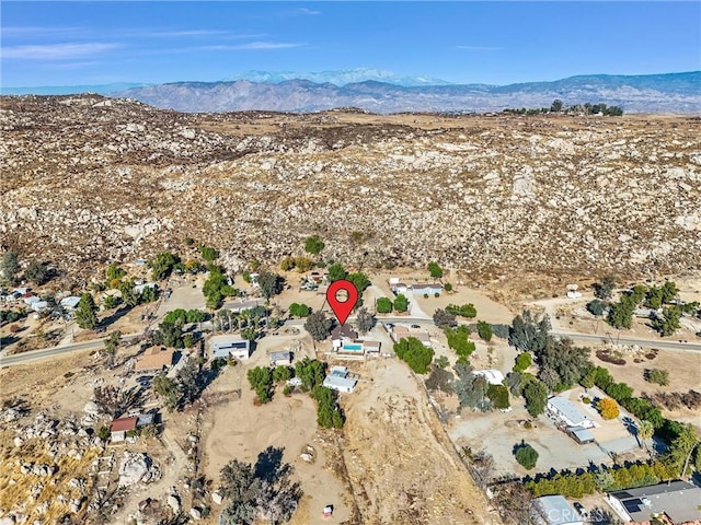 birds eye view of property featuring a mountain view