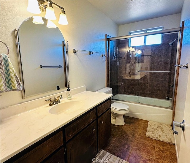 full bathroom featuring tile patterned flooring, vanity, enclosed tub / shower combo, and toilet