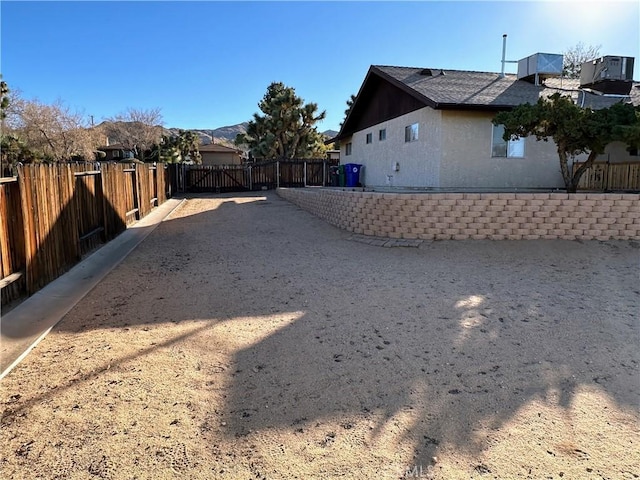 view of yard featuring central AC