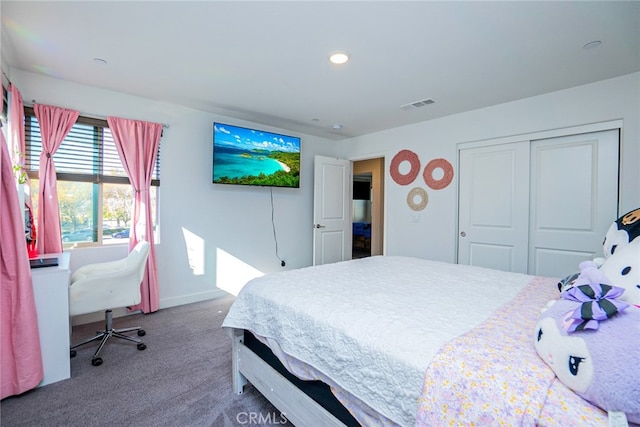 bedroom with carpet and a closet