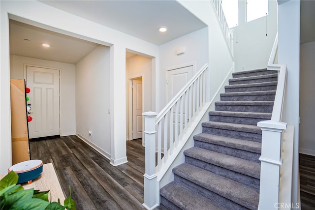 staircase featuring hardwood / wood-style floors