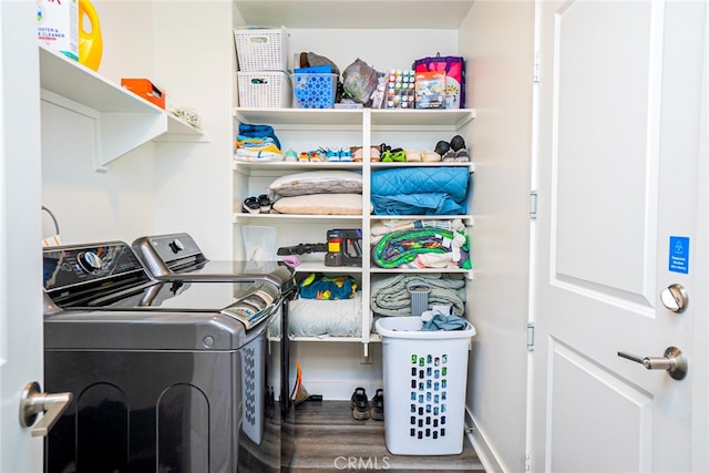 washroom with hardwood / wood-style floors and independent washer and dryer