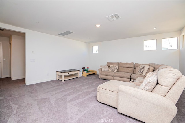 carpeted living room with plenty of natural light