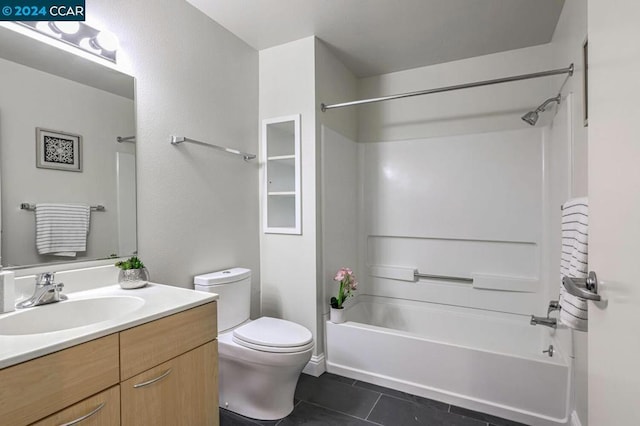 full bathroom featuring tile patterned floors, vanity, toilet, and shower / tub combination