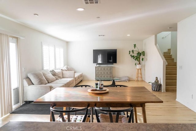 dining area with light hardwood / wood-style floors