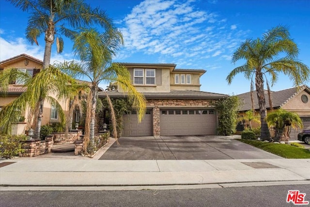 view of front of property with a garage