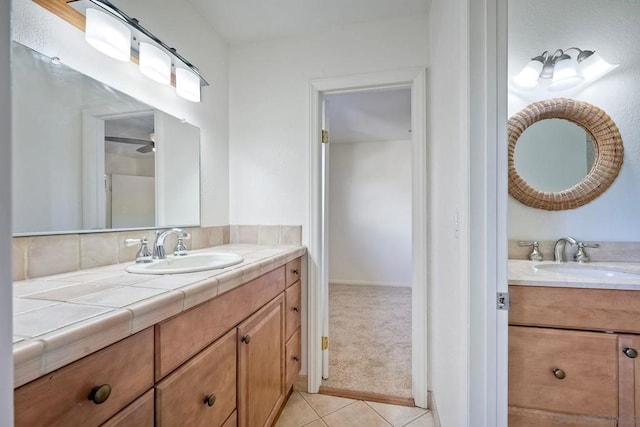 bathroom featuring tile patterned flooring and vanity