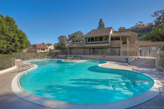 view of swimming pool featuring a patio area