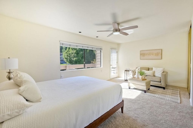 bedroom featuring ceiling fan and light carpet