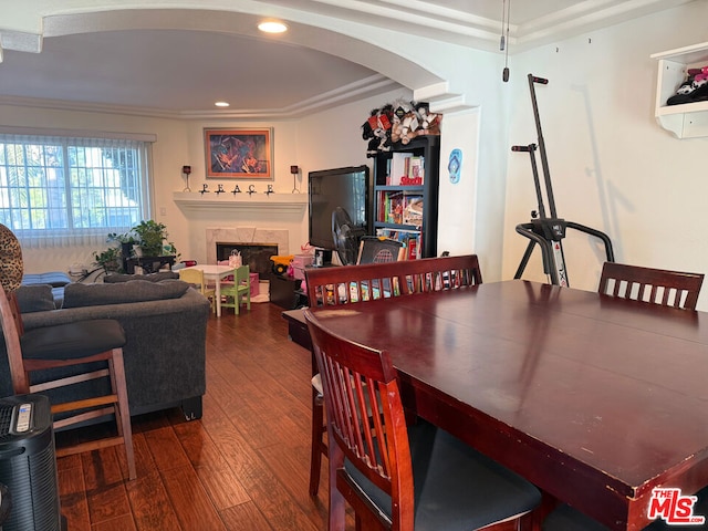 dining room featuring hardwood / wood-style flooring and crown molding