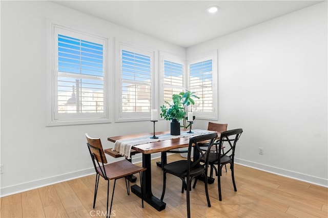 dining room with light wood-type flooring