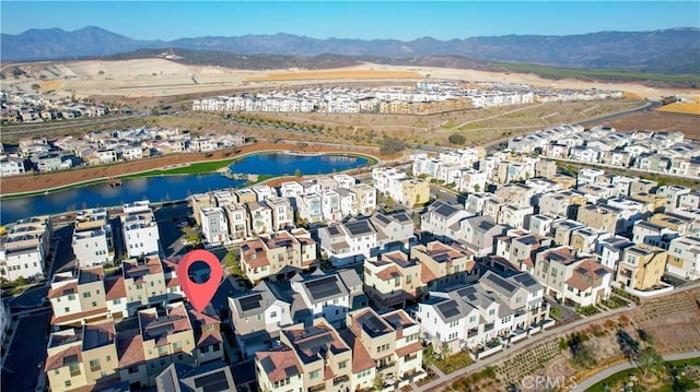 bird's eye view with a water and mountain view