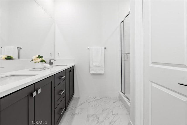 bathroom with a shower with door and vanity