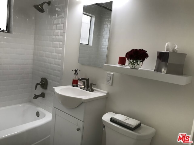 full bathroom featuring shower / bathing tub combination, vanity, and toilet