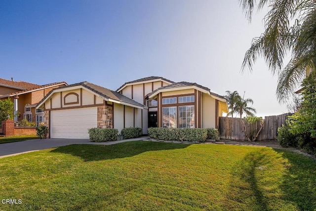 view of front facade with a front yard and a garage