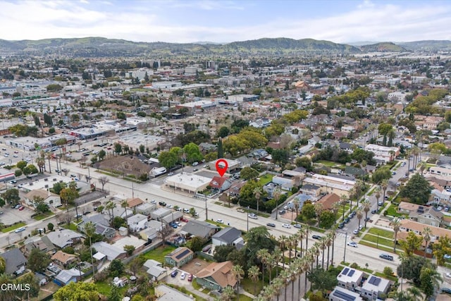 birds eye view of property featuring a mountain view